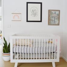 bright nursery with mixed patterns and artwork