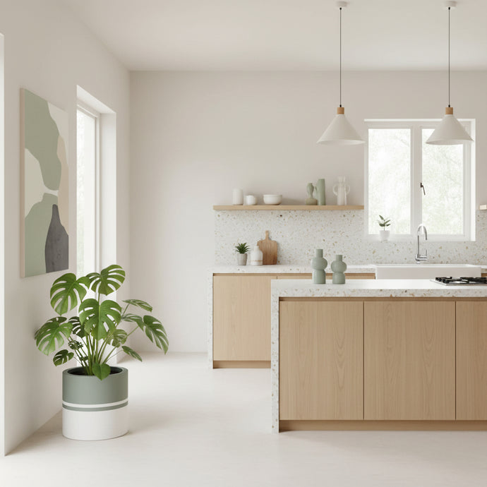 Modern kitchen with wooden cabinets, white countertops, and a plant.