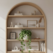 Wooden arch-shaped bookshelf with decorative items in a living room setting