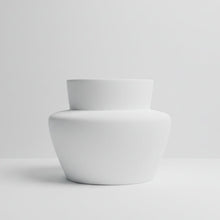 White fiberstone vase on a light grey background