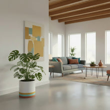 Modern living room with a gray sofa, coffee table, and decorative items.