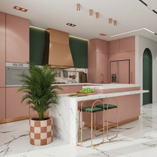 Modern kitchen with pink cabinets, green plant, and marble floor.