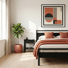 Modern bedroom with a bed, nightstand, and abstract art on the wall.
