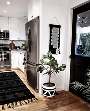 Aztec planter in black and white kitchen with potted fiddle lea fig tree