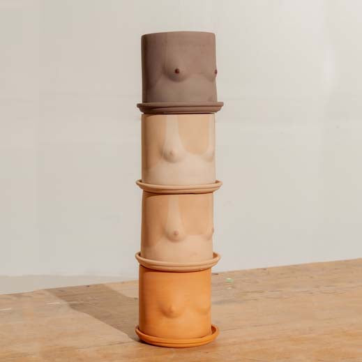 STACK OF CLASSIC BOOB PLANTER POTS WITH SAUCERS FROM GROUP PARTNER