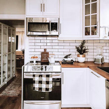 White planter with gold accent on kitchen countertop