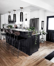 white and black hand painted planter in monochrome kitchen