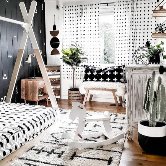 black and white planter pot in boy's monochromatic decor room with euphorbia cowboy cactus