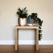colourful planters on stool in modern living room