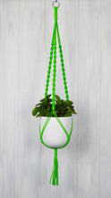 Neon green plant hanger with a White Essential hand painted planter