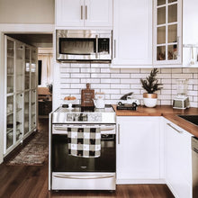 White planter with gold accent on kitchen countertop